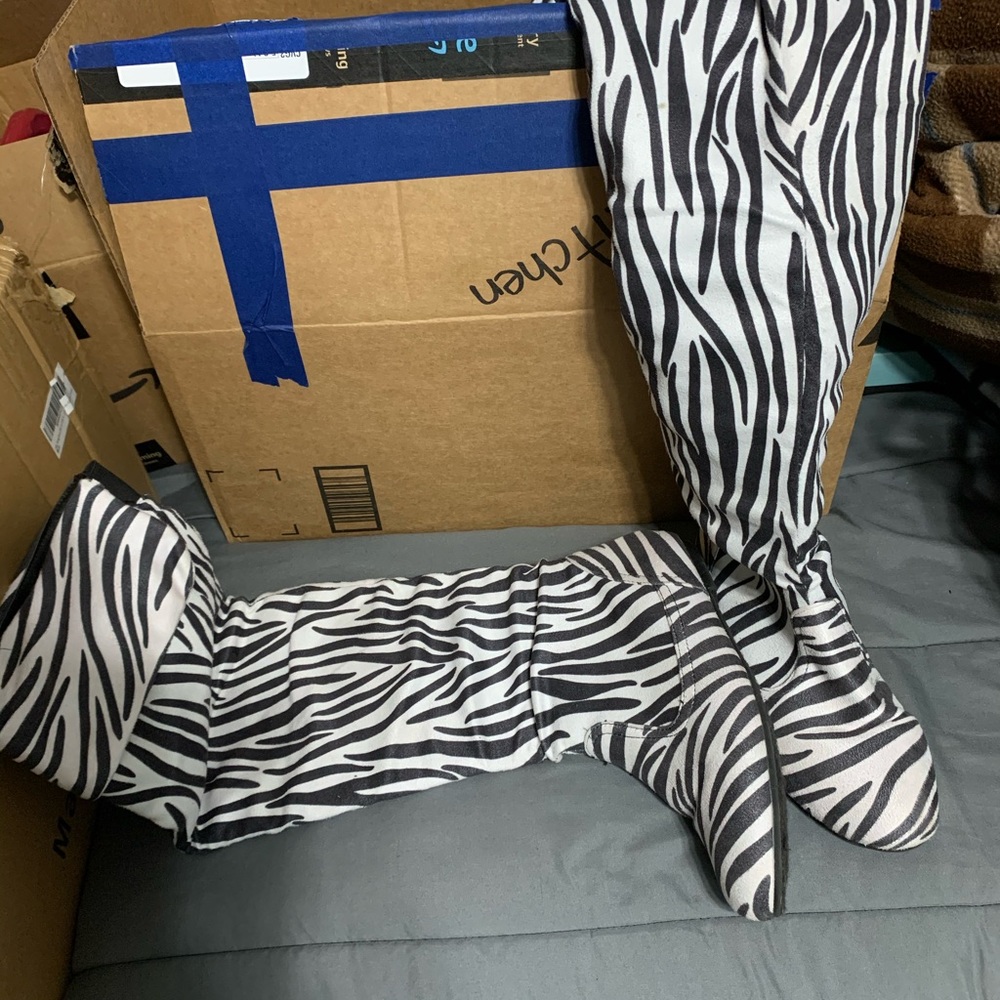 Knee high zebra boots. Size 8 worn a few times.